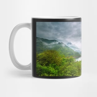 Lake in the mountains on a foggy day Mug